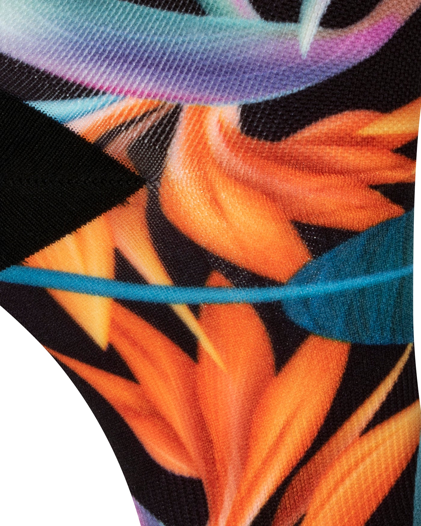 Textured heel view of black seamless toe sock with vibrant green and orange bird of paradise print design and black heel.