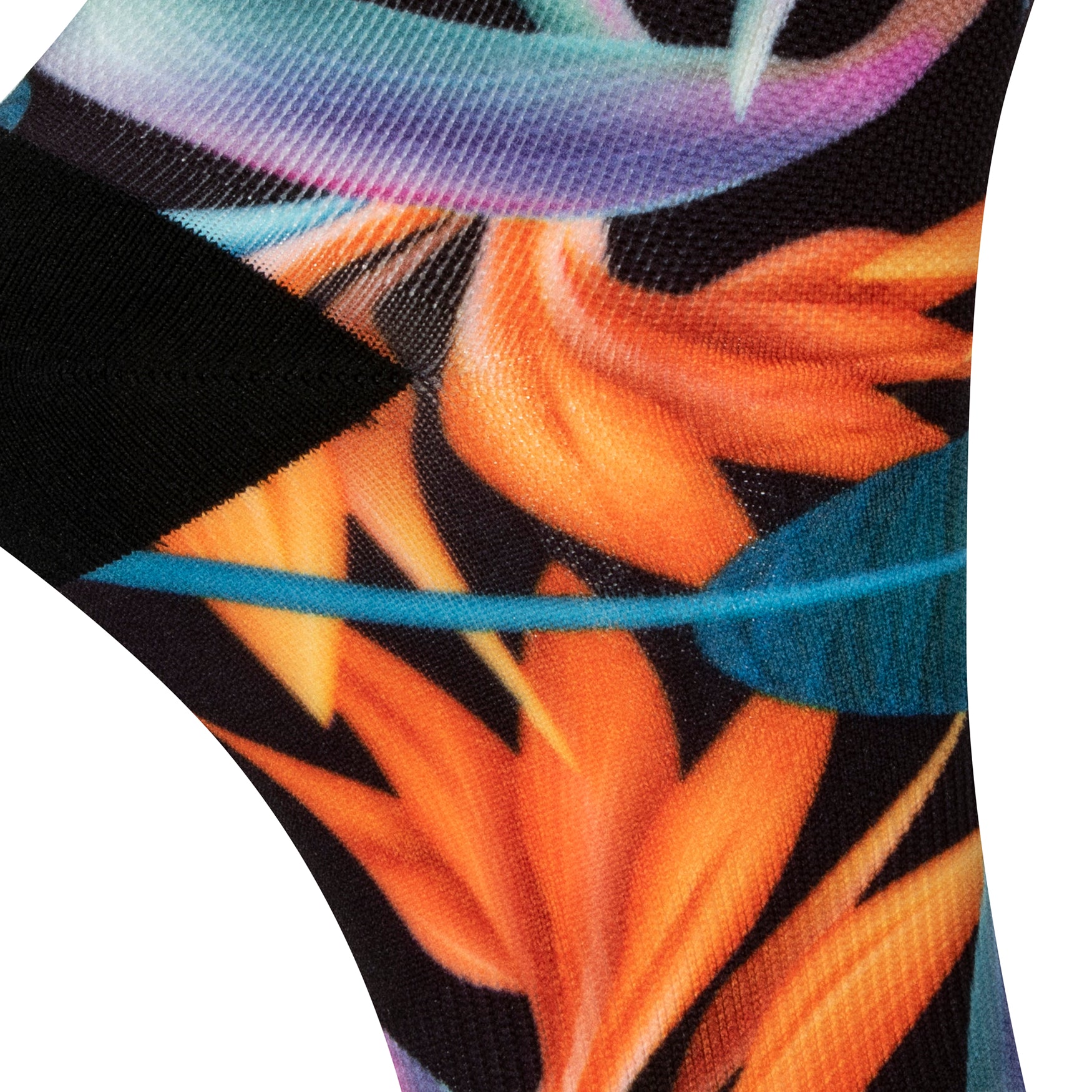 Textured heel view of black seamless toe sock with vibrant green and orange bird of paradise print design and black heel.