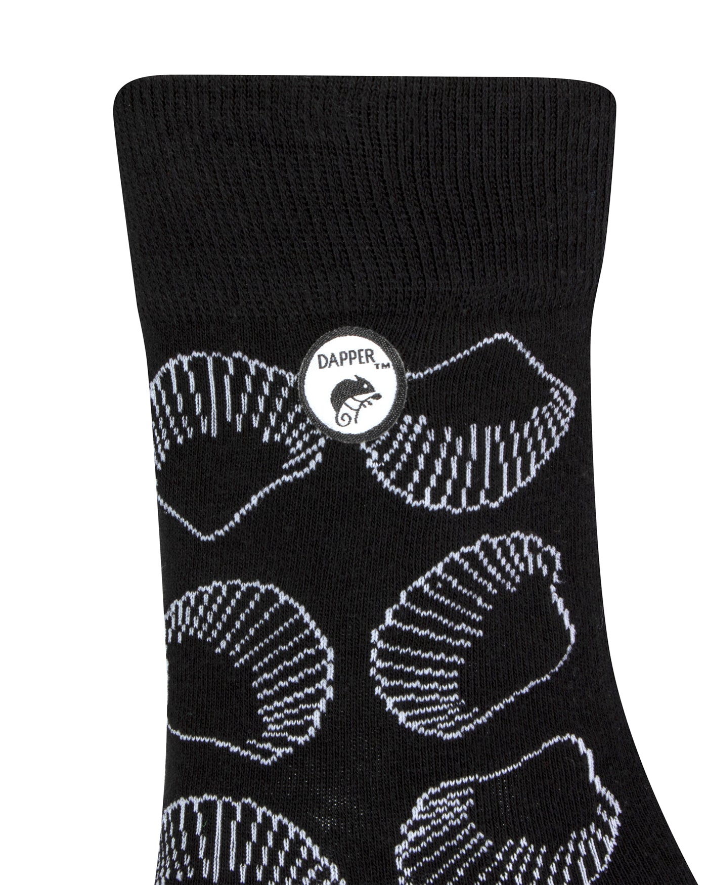 Side view of a combed cotton black seamless toe anklet with white outlined sea shells with Dapper Chameleon logo.