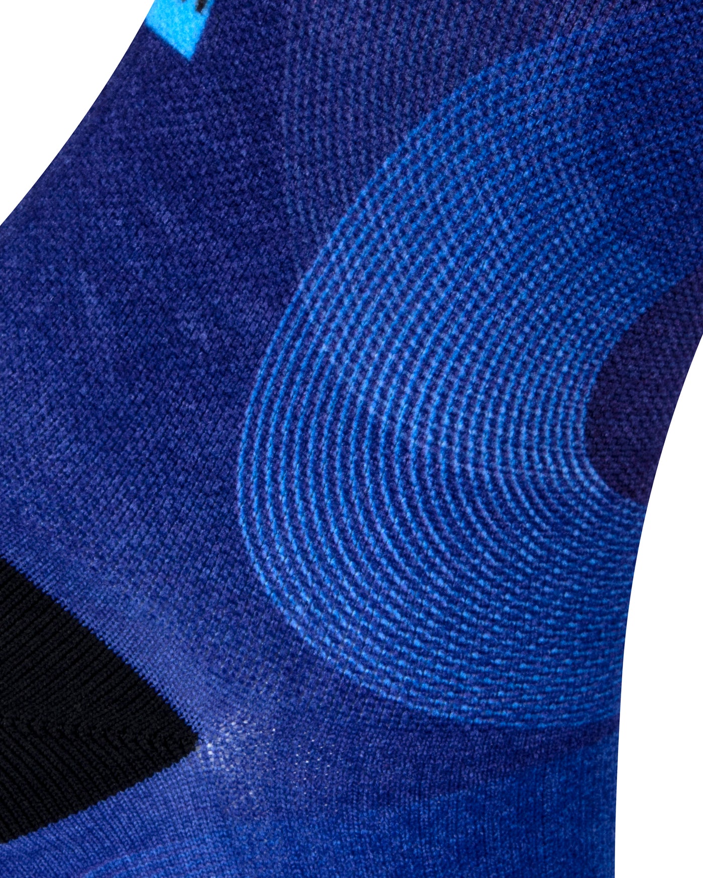 Textured heel view of blue seamless toe sock with abstract print design and black heel.