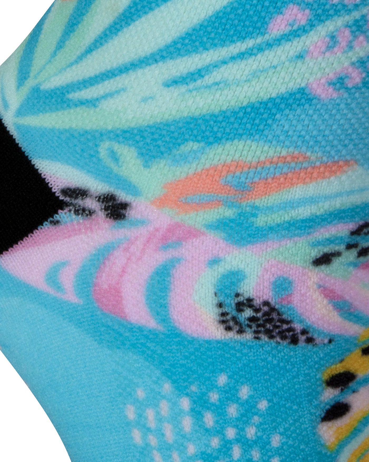Textured heel view of a seamless toe sock with pastel blue, pink, salmon and yellow fern design print and black heel and toe.