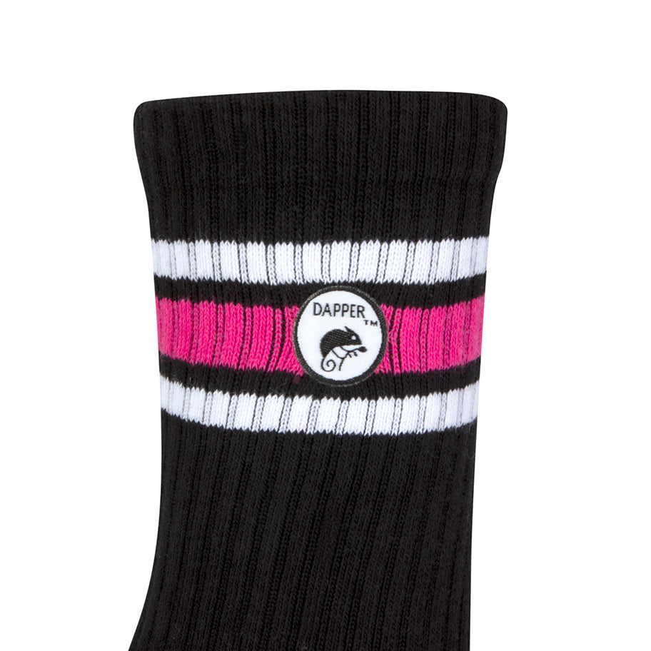 Side view of a long length ribbed black combed cotton seamless toe anklet with neon pink and white stripes with Dapper Chameleon logo.