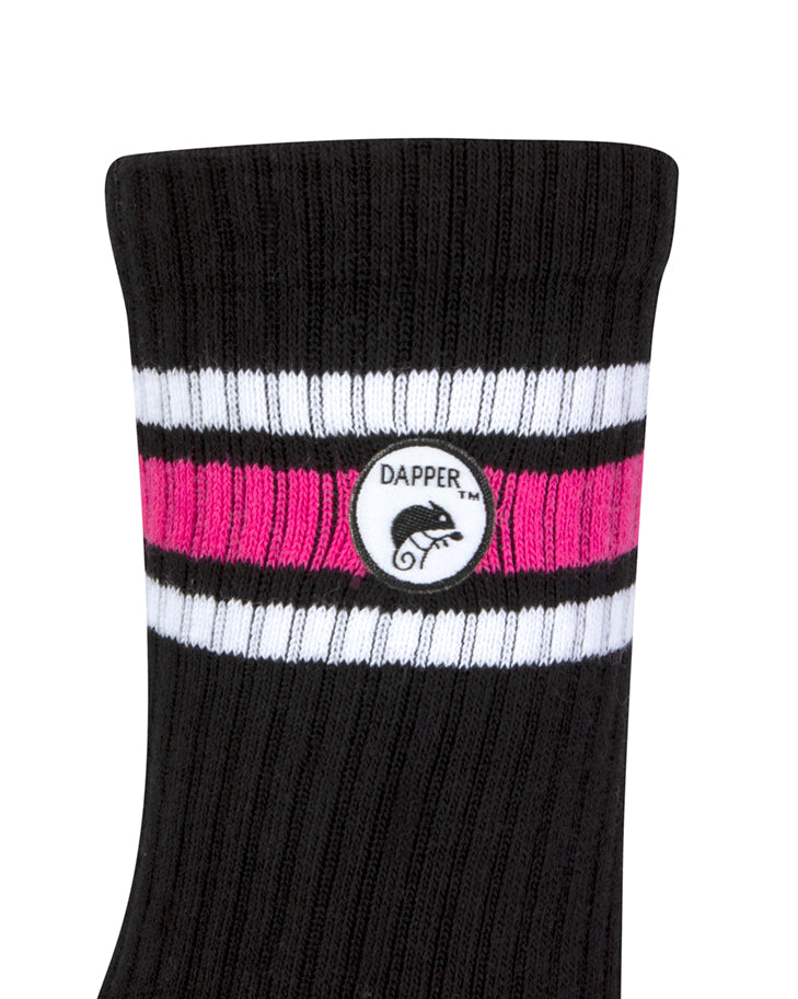 Side view of a long length ribbed black combed cotton seamless toe anklet with neon pink and white stripes with Dapper Chameleon logo.