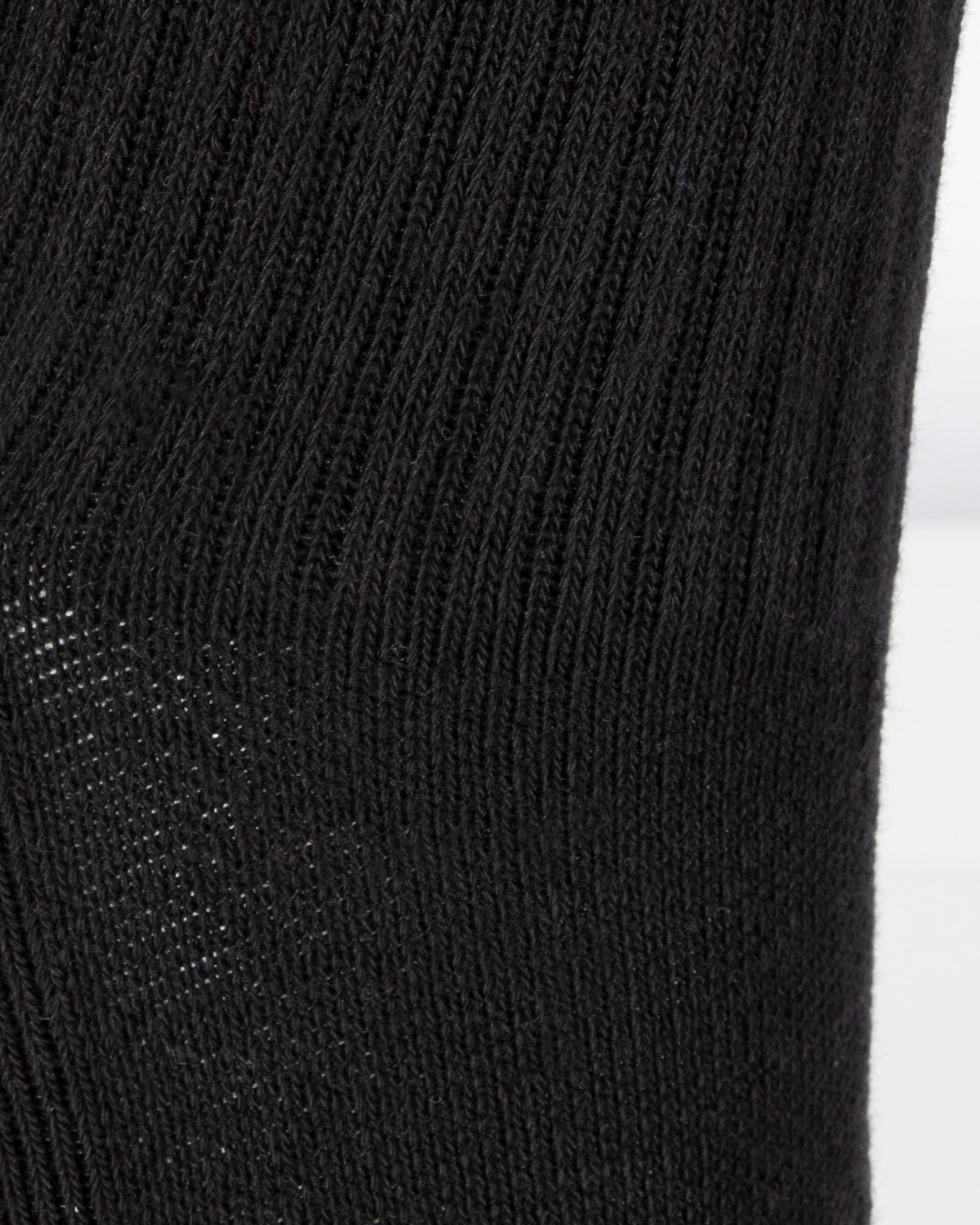 Textured view of a long length ribbed black combed cotton seamless toe anklet.