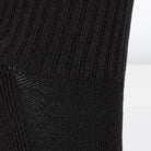 Textured view of a long length ribbed black combed cotton seamless toe anklet.