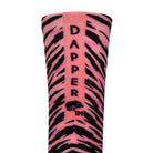 Back view of a pink seamless toe sock with black zebra stripe design print with a pink salmon strip with Dapper Chameleon wording and logo in black.