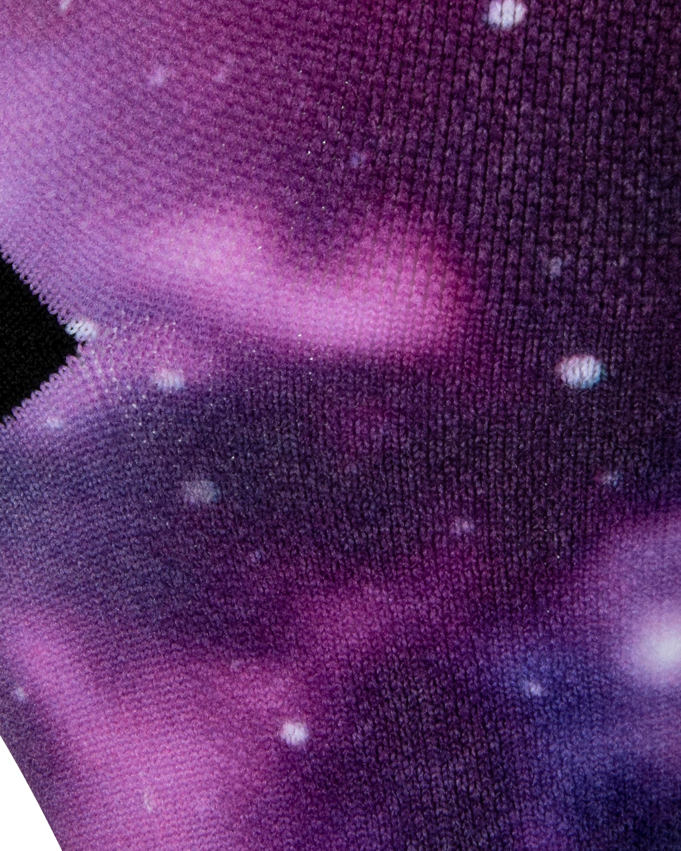 Textured heel view of a purple seamless toe sock with galaxy print design and black heel.