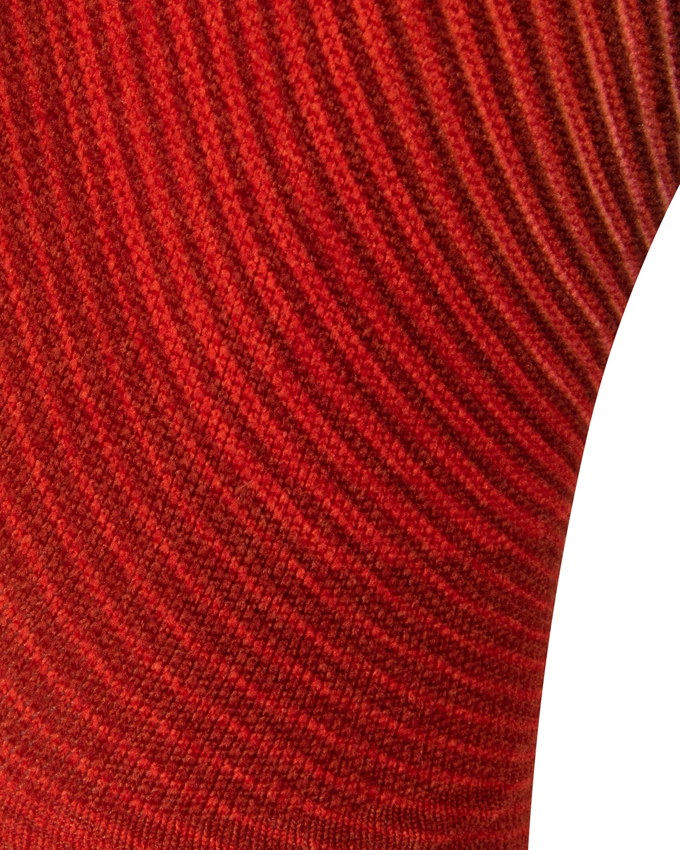 Close-up textured view of the red seamless toe sock with striped abstract print design.