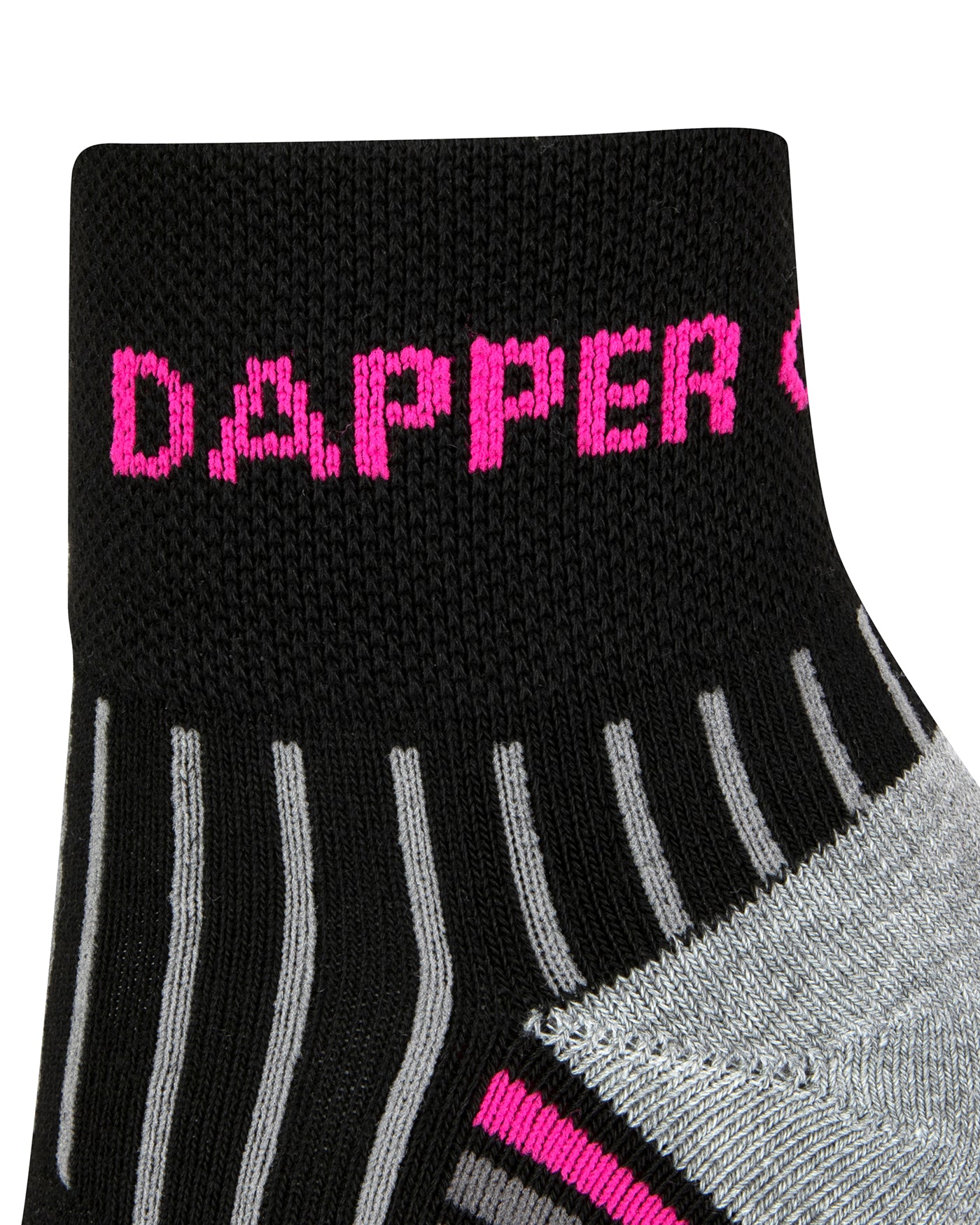 Side view of a black quarter length seamless toe sport sock with grey and neon pink stripes with a grey cushioned heel and Dapper Chameleon wording in the cuff.