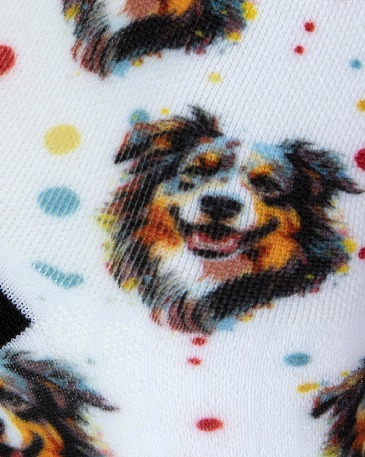 Textured heel view of a white seamless toe sock with bordercollie dog print design and black heel.