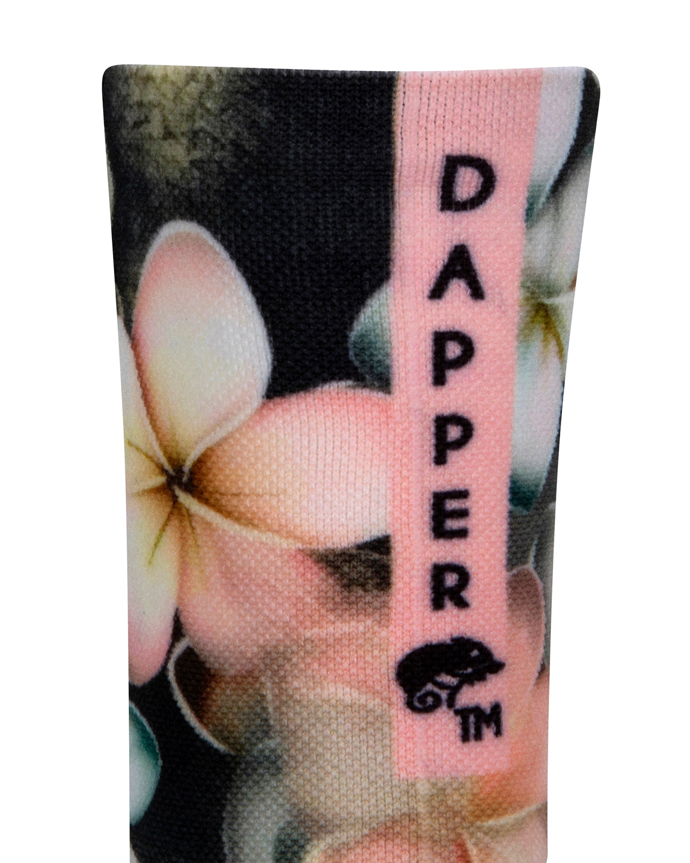 Back view of a dark grey seamless toe sock with pastel hues of white, cream, yellow, and light pink frangipani print design with a pastel pink strip with Dapper Chameleon wording and logo in black.