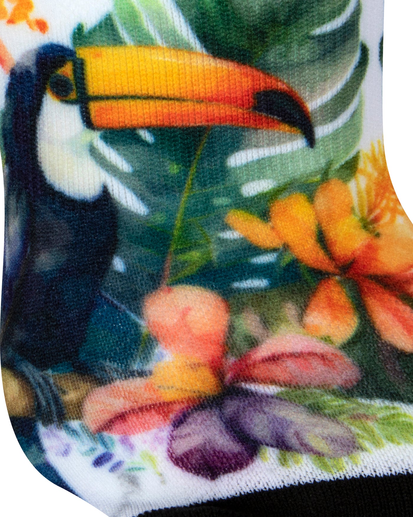 Textured heel view of a white seamless toe sock with bright toucans in the jungle design print and black toe.