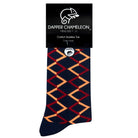 Header card packaging of a combed cotton dark navy seamless toe anklet with a red and orange diamond shape design with a dark navy heel and toe.