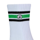 Side view of a long length ribbed white combed cotton seamless toe anklet with black and neon green stripes with Dapper Chameleon logo.