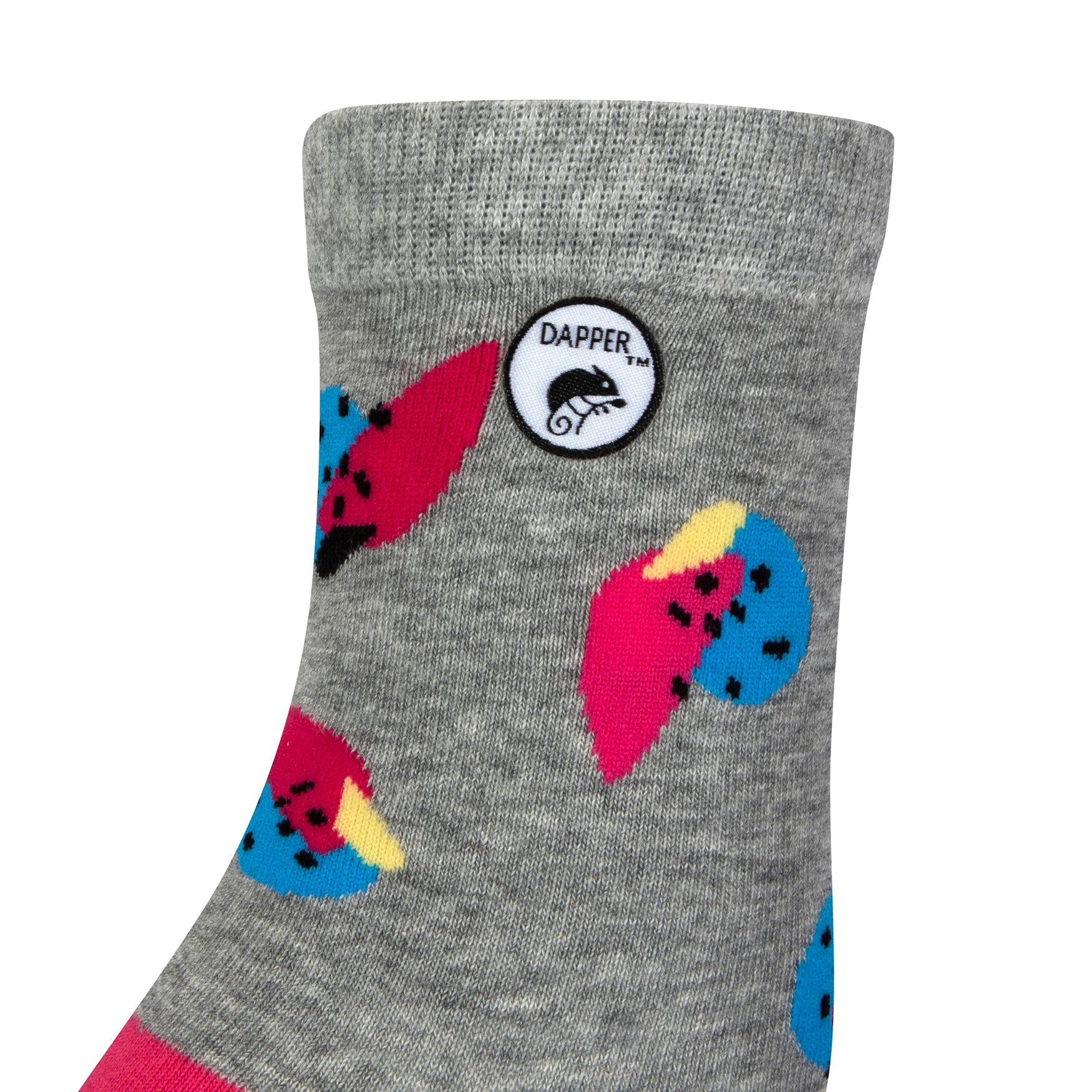 Side view of a combed cotton grey seamless toe anklet with cerise pink and blue fruit with a cerise heel and Dapper Chameleon logo.