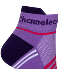 Side view of a purple seamless toe sport sock with neon pink and white stripes with a dark purple cushioned lip and heel and with purple Dapper Chameleon wording on the cuff.