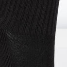 Textured view of a long length ribbed black combed cotton seamless toe anklet.  