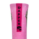 Back view of a Pink seamless toe sock with white dots and glamour cat print design with a bright pink strip with Dapper Chameleon wording and logo in black.