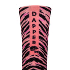 Back view of a pink seamless toe sock with black zebra stripe design print with a pink salmon strip with Dapper Chameleon wording and logo in black.