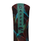 Back view of a black seamless toe sock with multi-colour abstract stripe design with a green strip with Dapper Chameleon wording and logo in black.