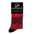 Header card packaging of a red seamless toe sock with red hearts print design and black heel and toe.