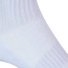 Textured view of a long length ribbed white combed cotton seamless toe anklet with cushioned foot and circular gripper around the arch of the foot.