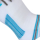 Textured view of the white quarter length seamless toe sport sock with grey and sky blue stripes on the bottom arch of the sock.