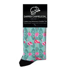 Header card packaging of a pastel mint green seamless toe sock with pink flamingo and green tropical leaves design print and black heel and toe.