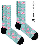 A Computer-Aided Design of a pastel mint green seamless toe sock with pink flamingo and green tropical leaves design print and black heel and toe.