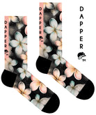 A Computer-Aided Design of a dark grey seamless toe sock with pastel hues of white, cream, yellow, and light pink frangipani print design and black heel and toe.