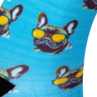 Textured heel view of a bright sky blue seamless toe sock with French bulldog wearing yellow sunglasses and black heel.