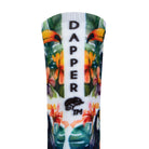 Back view of a white seamless toe sock with bright toucans in the jungle design print with a white strip with Dapper Chameleon wording and logo in black.