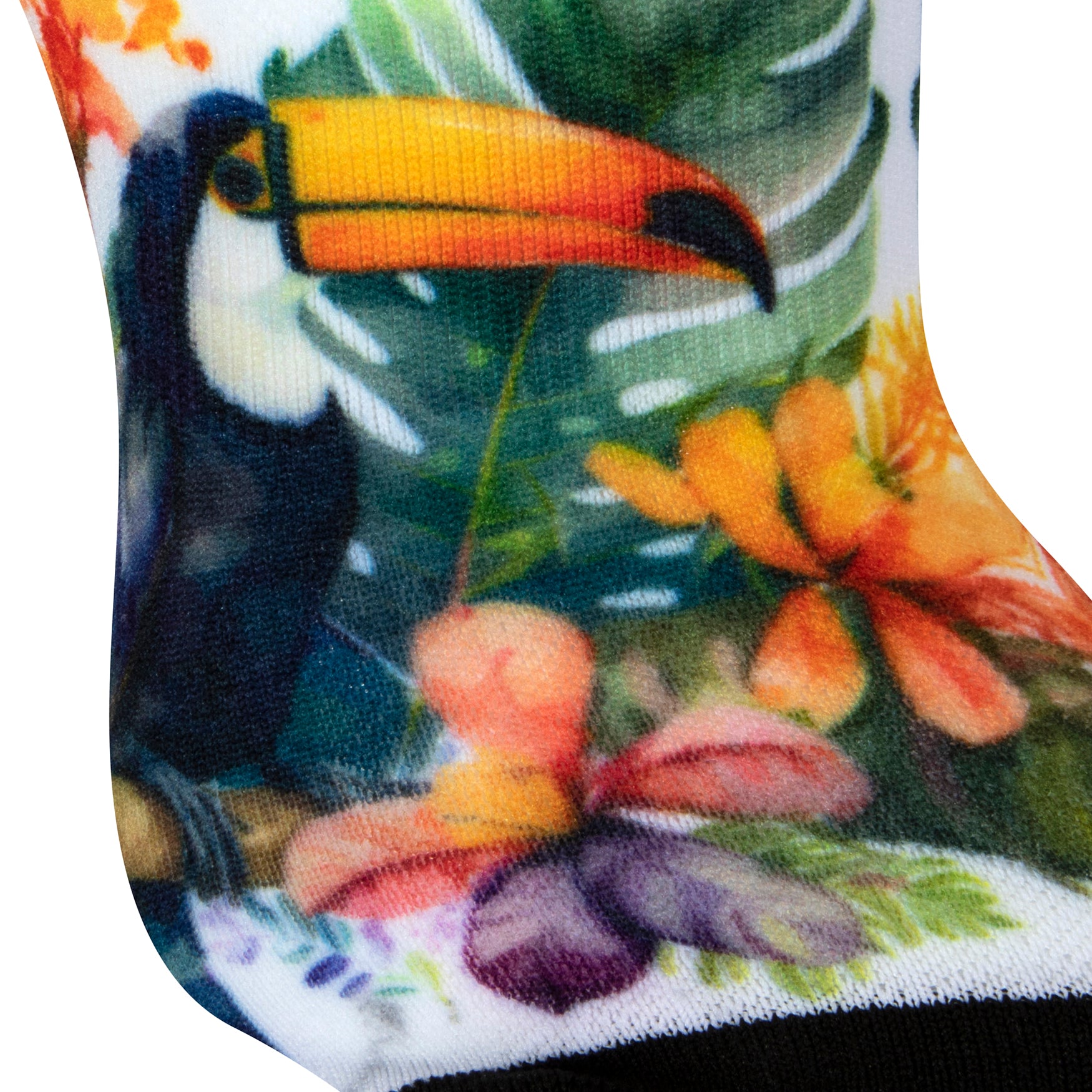 Textured heel view of a white seamless toe sock with bright toucans in the jungle design print and black toe.